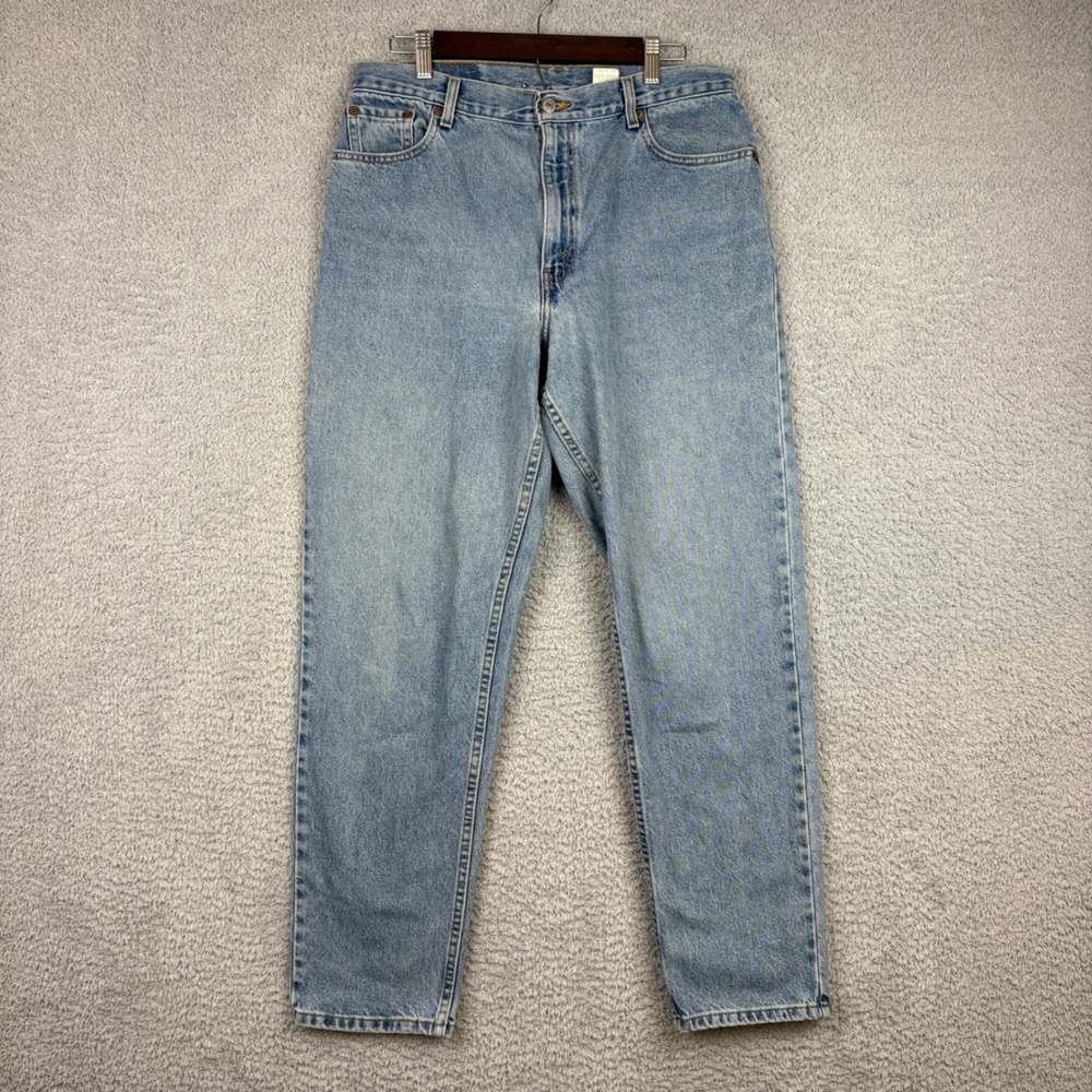 Vintage Levis Jeans Womens 14 32x30 Blue 550 Relaxed Tapered Light Wash 90s Y2K